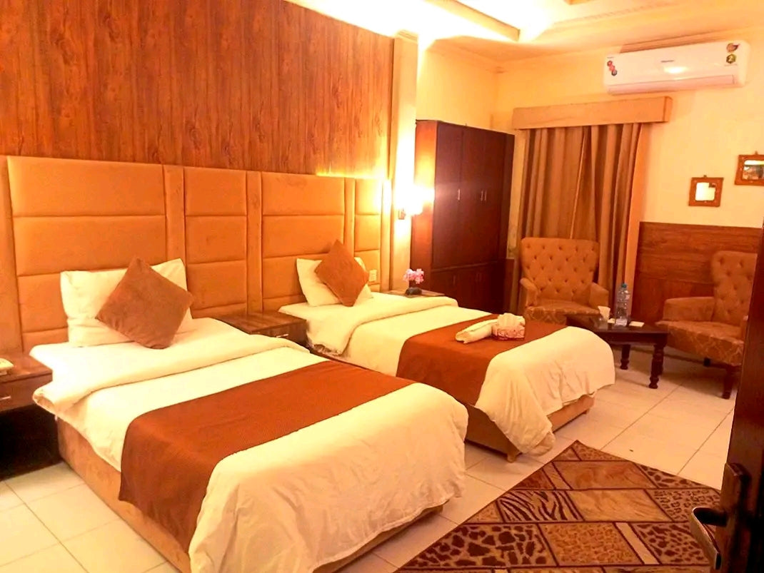 303 – Twin Beds | PKR 6,800 |Adams Lodge F-7  Capacity: 2 Guests