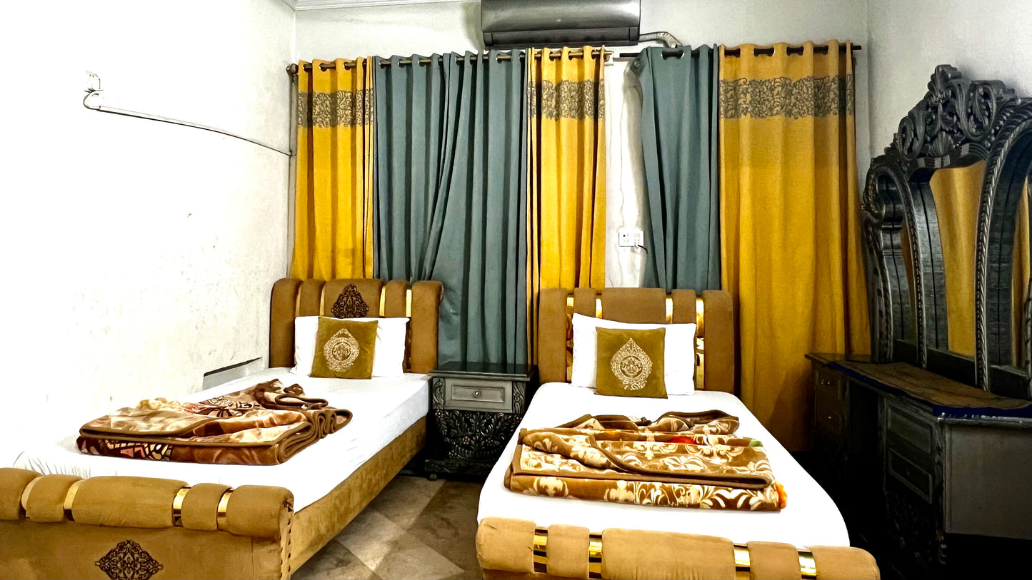 G3 – 4 Single Beds | Galaxy Lodge  Price: PKR 15000 / night Capacity: 4 Guests