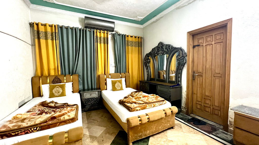 G3 – 4 Single Beds | Galaxy Lodge  Price: PKR 15000 / night Capacity: 4 Guests