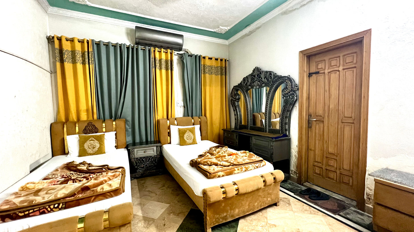 G3 – 4 Single Beds | Galaxy Lodge  Price: PKR 15000 / night Capacity: 4 Guests