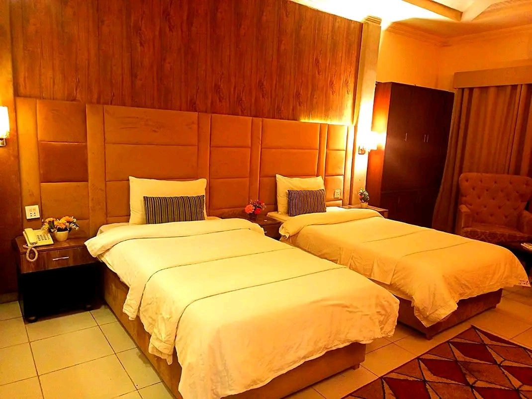 303 – Twin Beds | PKR 6,800 |Adams Lodge F-7  Capacity: 2 Guests