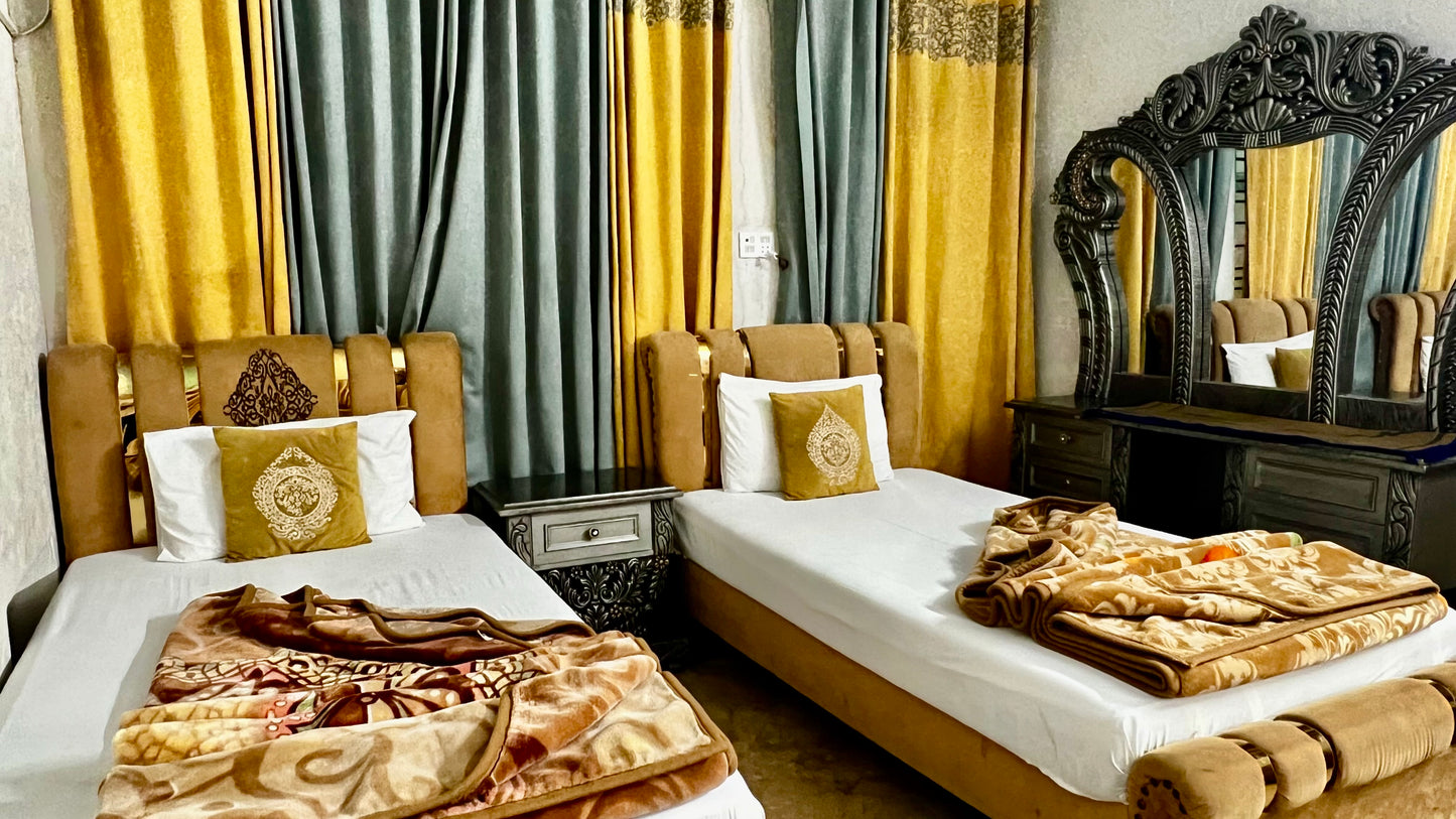 G3 – 4 Single Beds | Galaxy Lodge  Price: PKR 15000 / night Capacity: 4 Guests